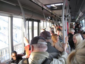 People of every means take the bus. This one is very crowded!